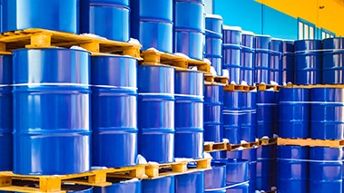 Blue barrels stacked on pallets