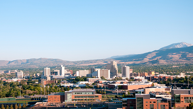 City skyline with mountains