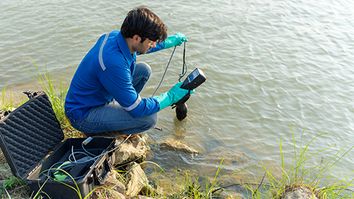 Man with equipment testing water